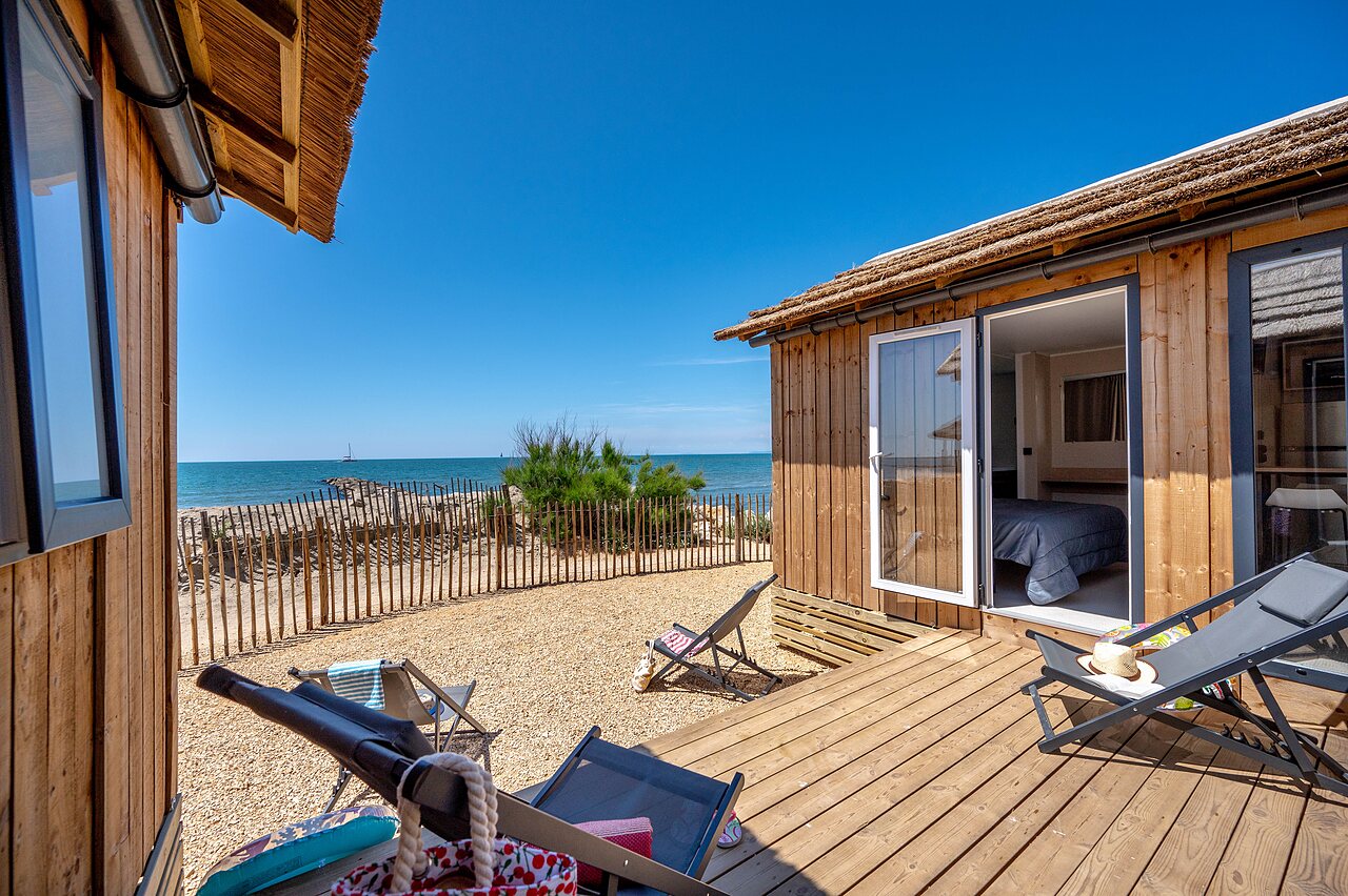 Houten chalet, terras, zeezicht, camping CAPFUN Boucanet LE GRAU DU ROI (30).