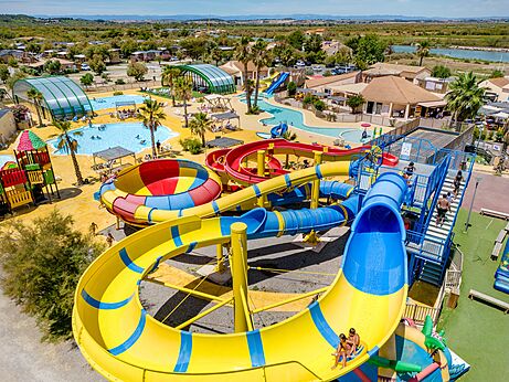 Waterpark, glijbanen en zwembaden op camping VAGUES OCEANES Hamacs in Fleury (11).