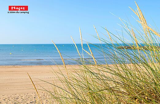 Fijn zandstrand en Middellandse Zee nabij camping CAPFUN Ondines in Vias Plage (34).